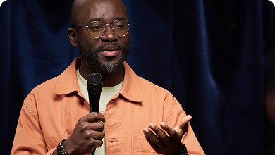 Person speaking into a microphone